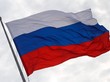 Symbolfoto: Die russische Flagge im Wind wehend vor wolkenverhangenem Himmel.