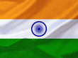 Orange-weiß-grüne Flagge mit blauem Emblem