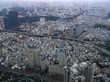 Ho-Chi-Minh-Stadt aus der Luft; unzählige Gebäude und Hochhäuser, durch die sich Straßen schlängeln